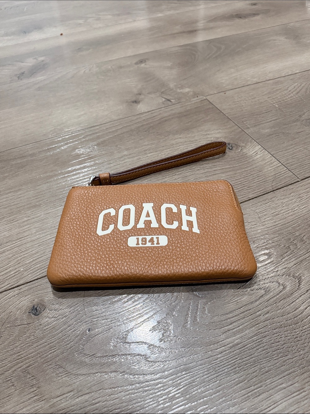 Coach Tan Pebbled Leather Wristlet with White Logo